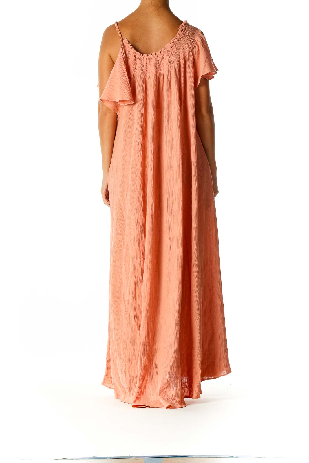 Back view of Free People peach maxi dress showing flowy design and full length