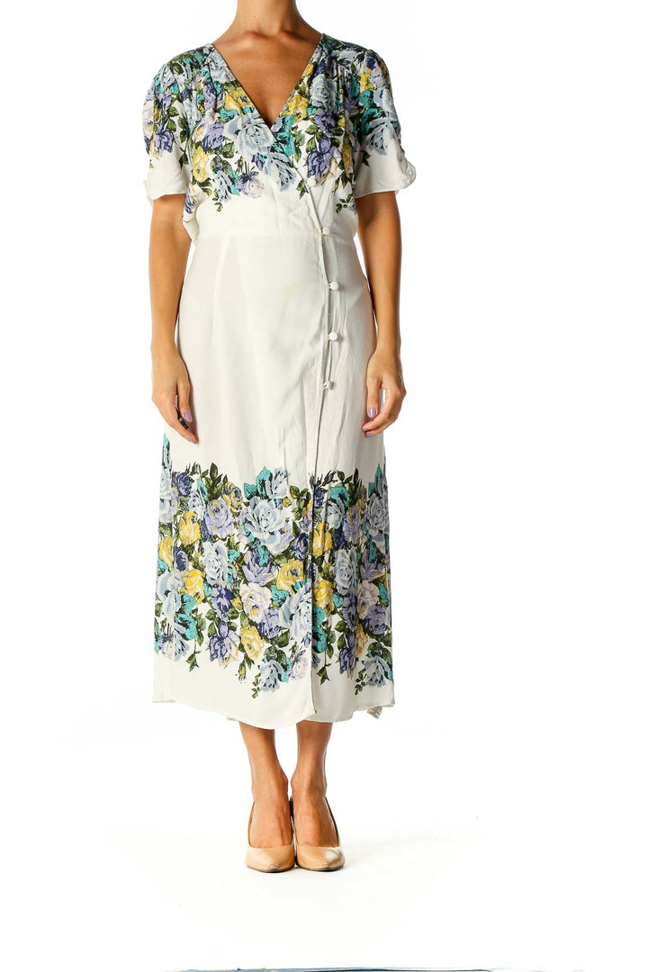 Front view of white floral wrap midi dress from Free People