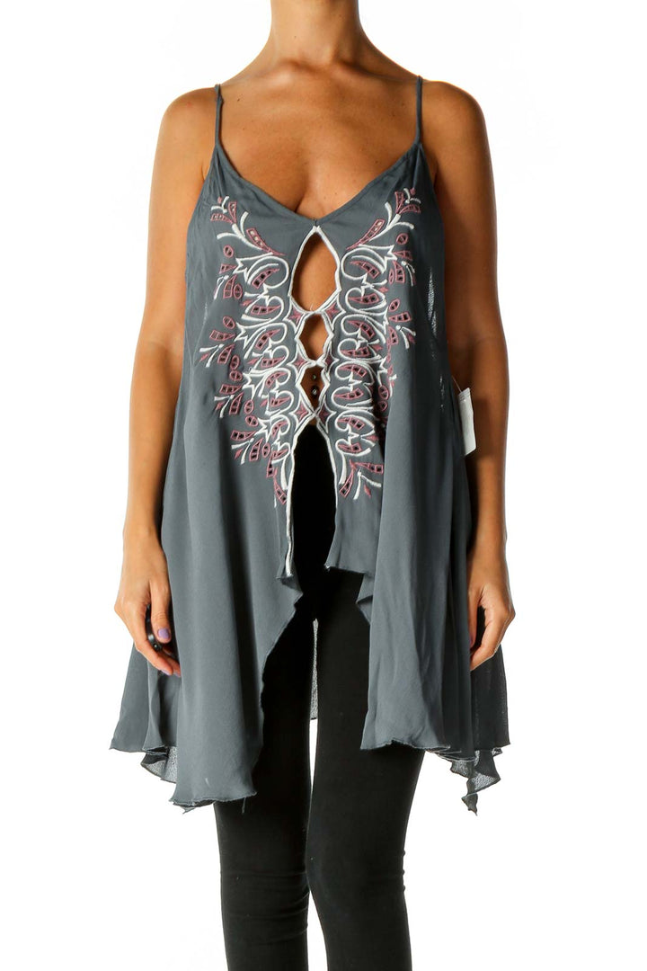 Front view of gray Free People tank top with white and pink embroidery and tie front