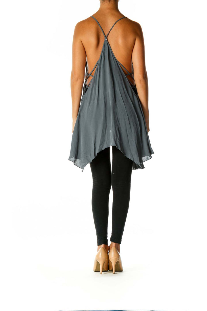 Back view of gray Free People tank top showing flowy handkerchief hem and thin straps