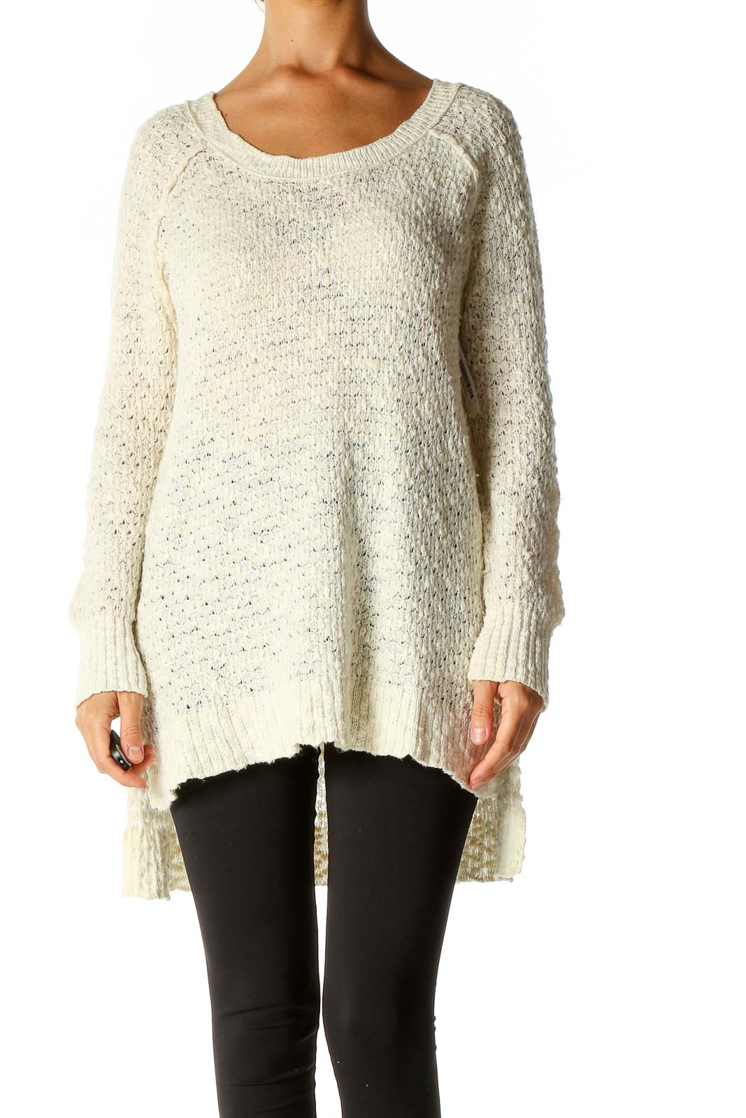 Front view of Free People cream oversized knit sweater on model