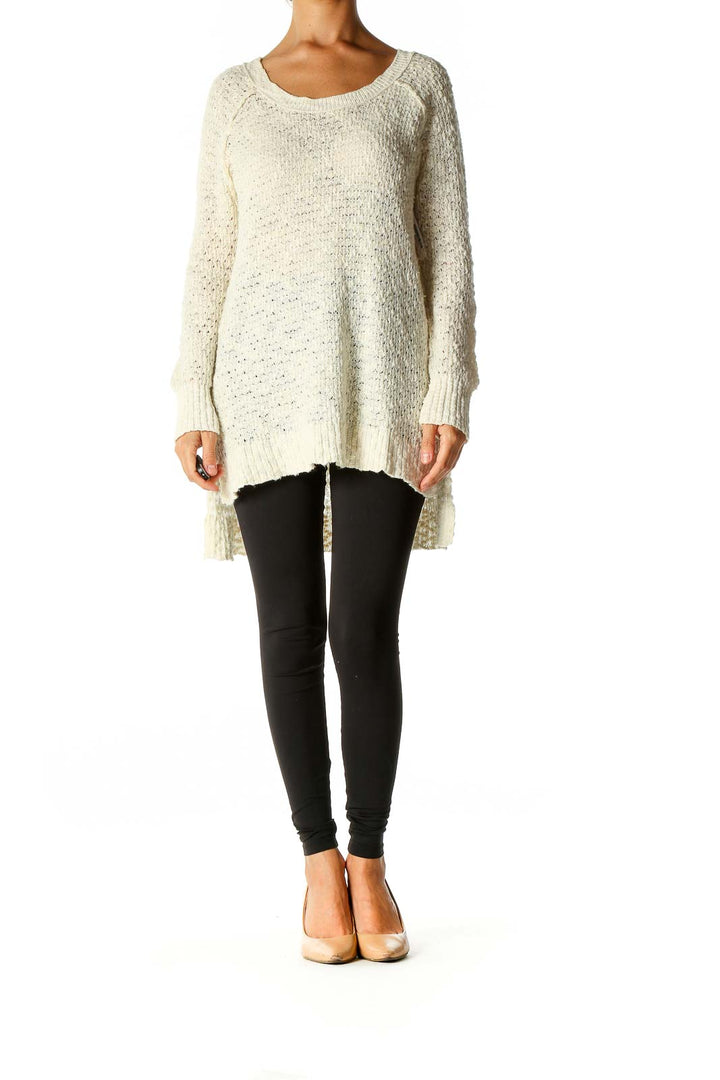 Front view of Free People cream oversized knit sweater on model