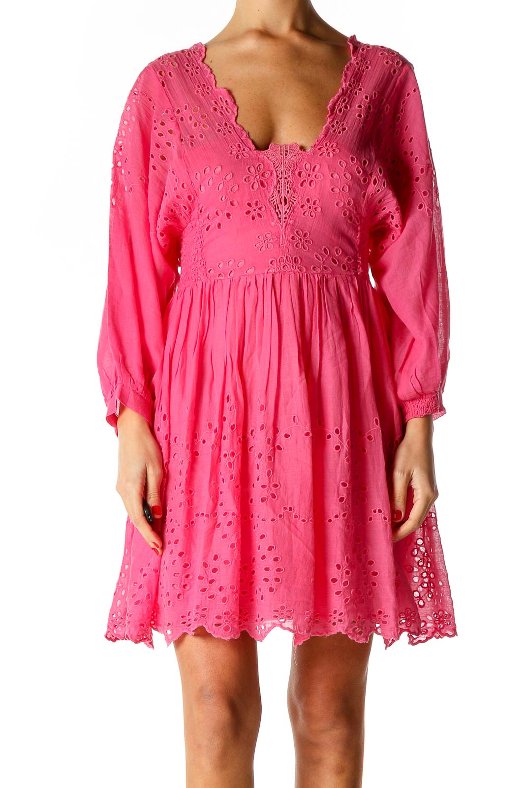 Front view of Free People pink eyelet lace mini dress with V-neckline and long sleeves