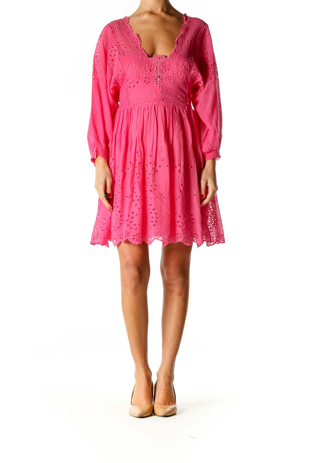 Front view of Free People pink eyelet lace mini dress with V-neckline and long sleeves