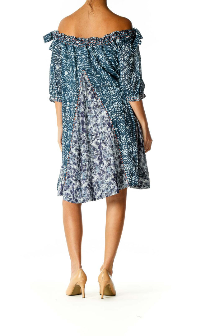 Back view of Free People blue floral off-shoulder midi dress