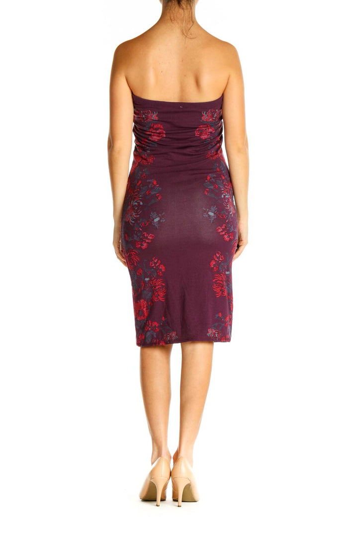 Back view of burgundy strapless bodycon dress showing floral pattern and form-fitting silhouette