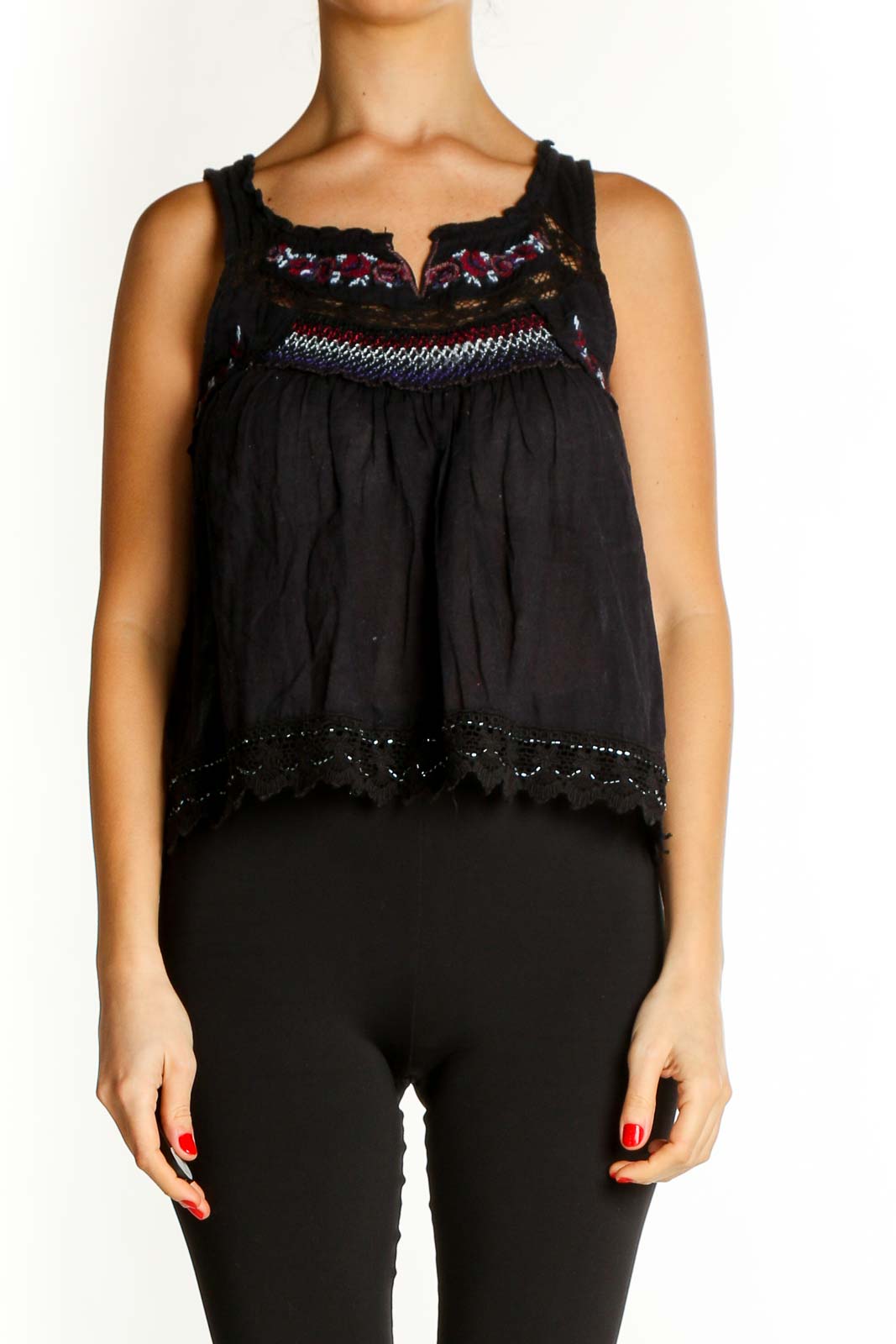 Front view of Free People black embroidered tank top with lace details