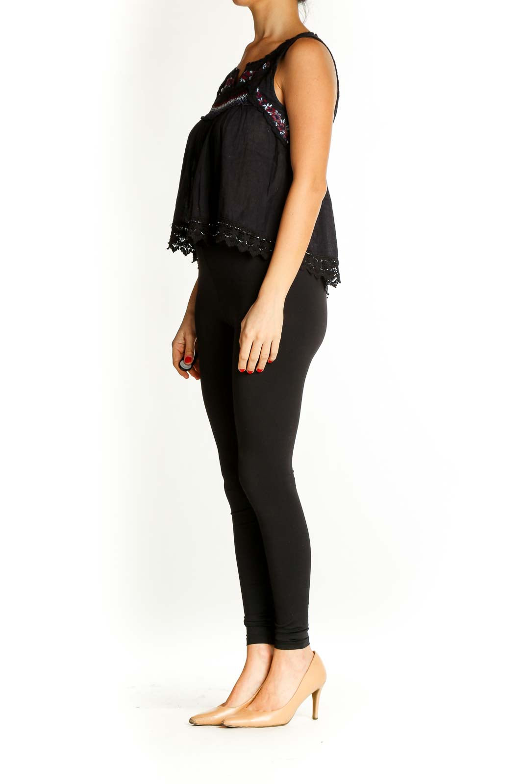 Front view of Free People black embroidered tank top with lace details