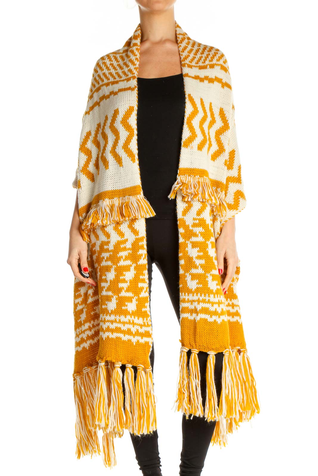 Front view of Free People yellow and white patterned knit cardigan with fringe details