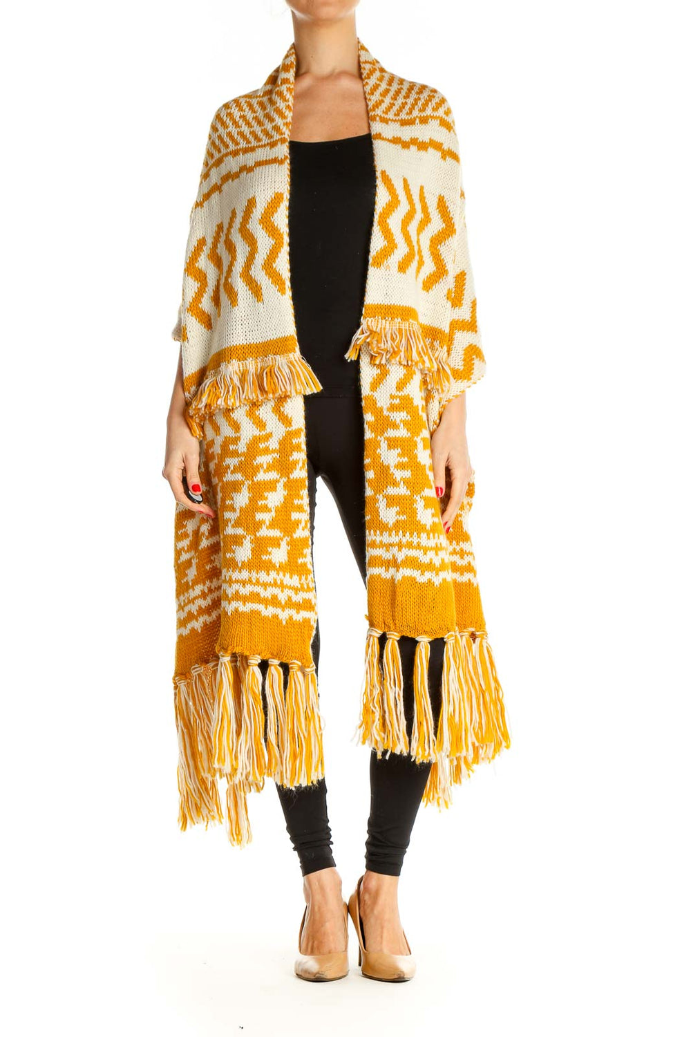 Front view of Free People yellow and white patterned knit cardigan with fringe details