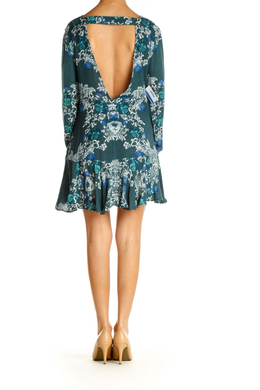 Back view of Free People green floral mini dress with open back design