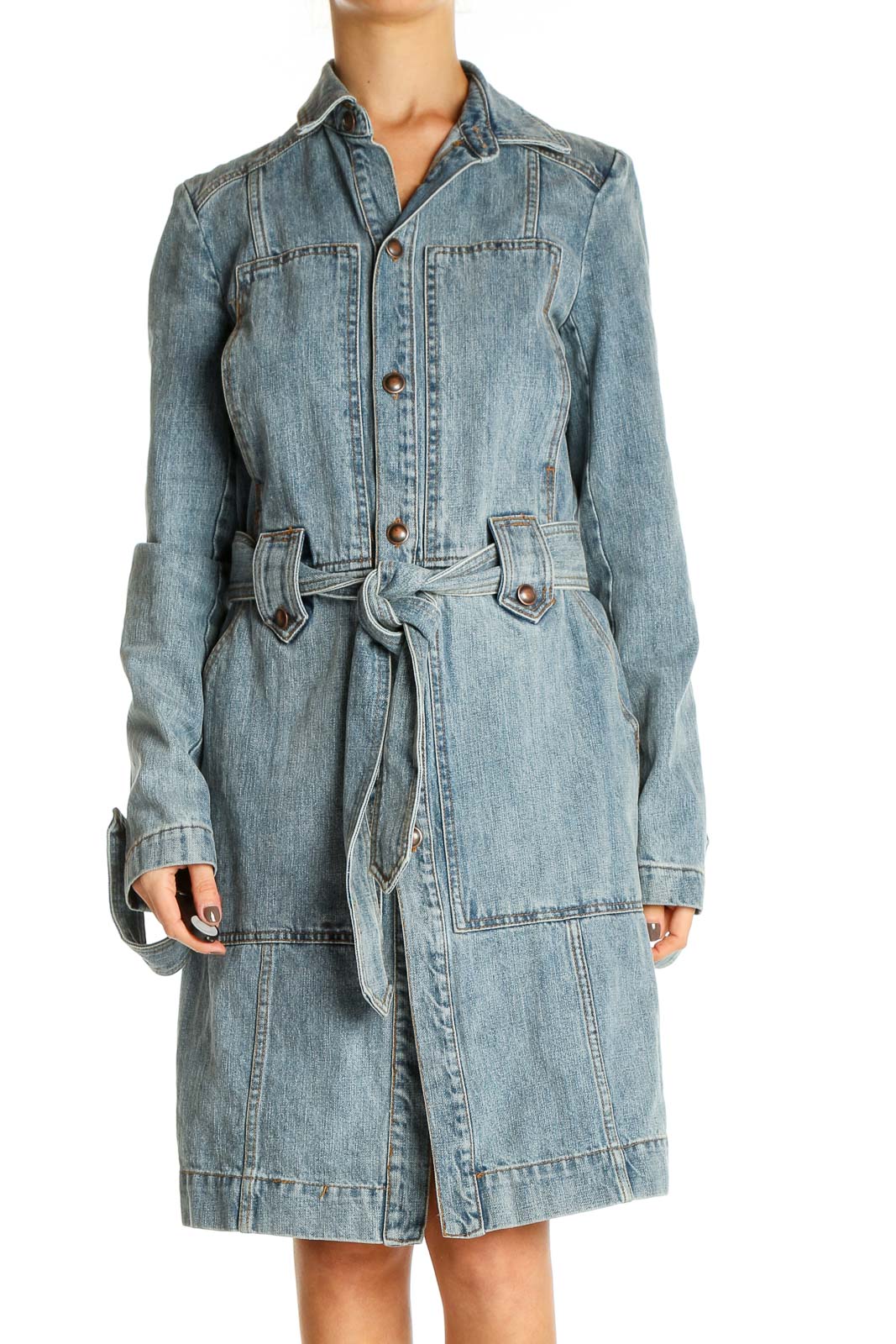 Front view of Free People light blue denim trench coat with belted waist