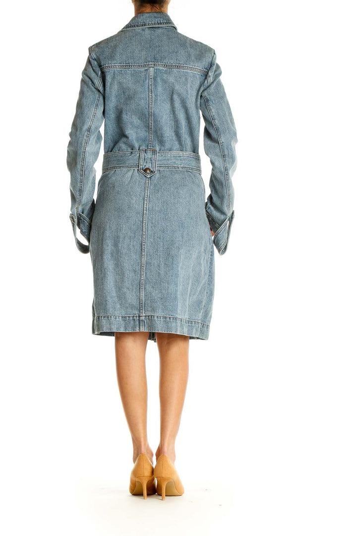 Back view of Free People light blue denim trench coat showing detailed stitching