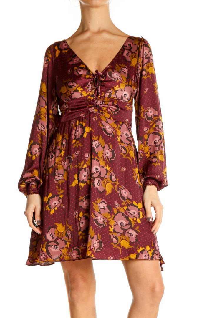 Front view of Free People burgundy floral V-neck empire waist dress with long balloon sleeves