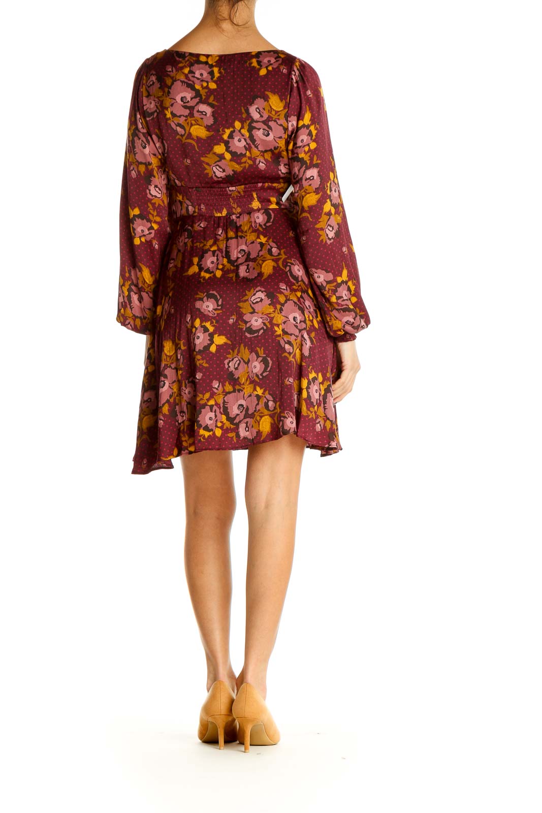 Back view of Free People burgundy floral empire waist dress showing flowing skirt and long sleeves