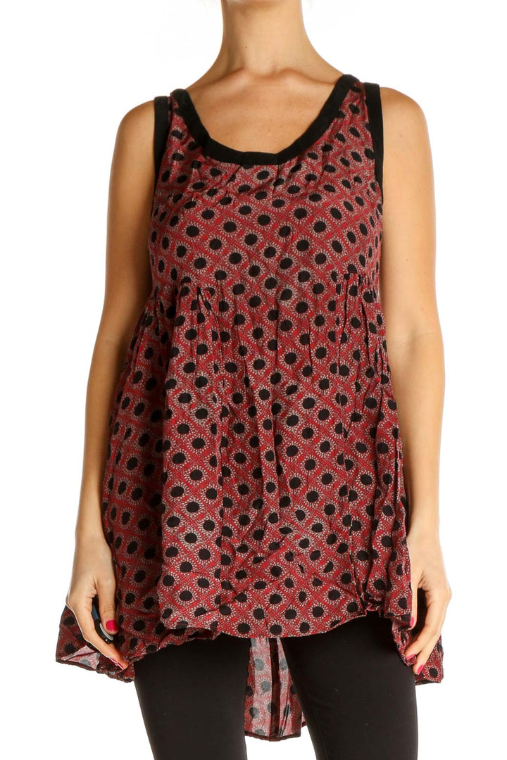 Front view of Free People red polka dot flowy tank top with black trim