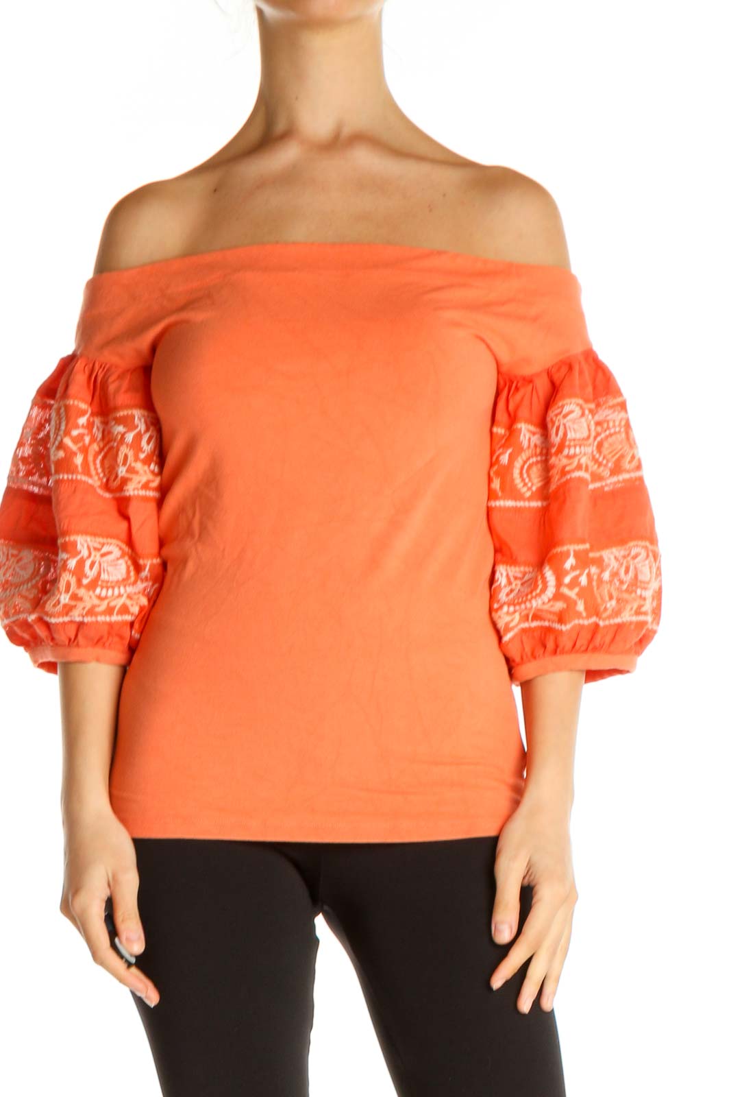 Front view of orange Free People off-shoulder top with embroidered sleeves