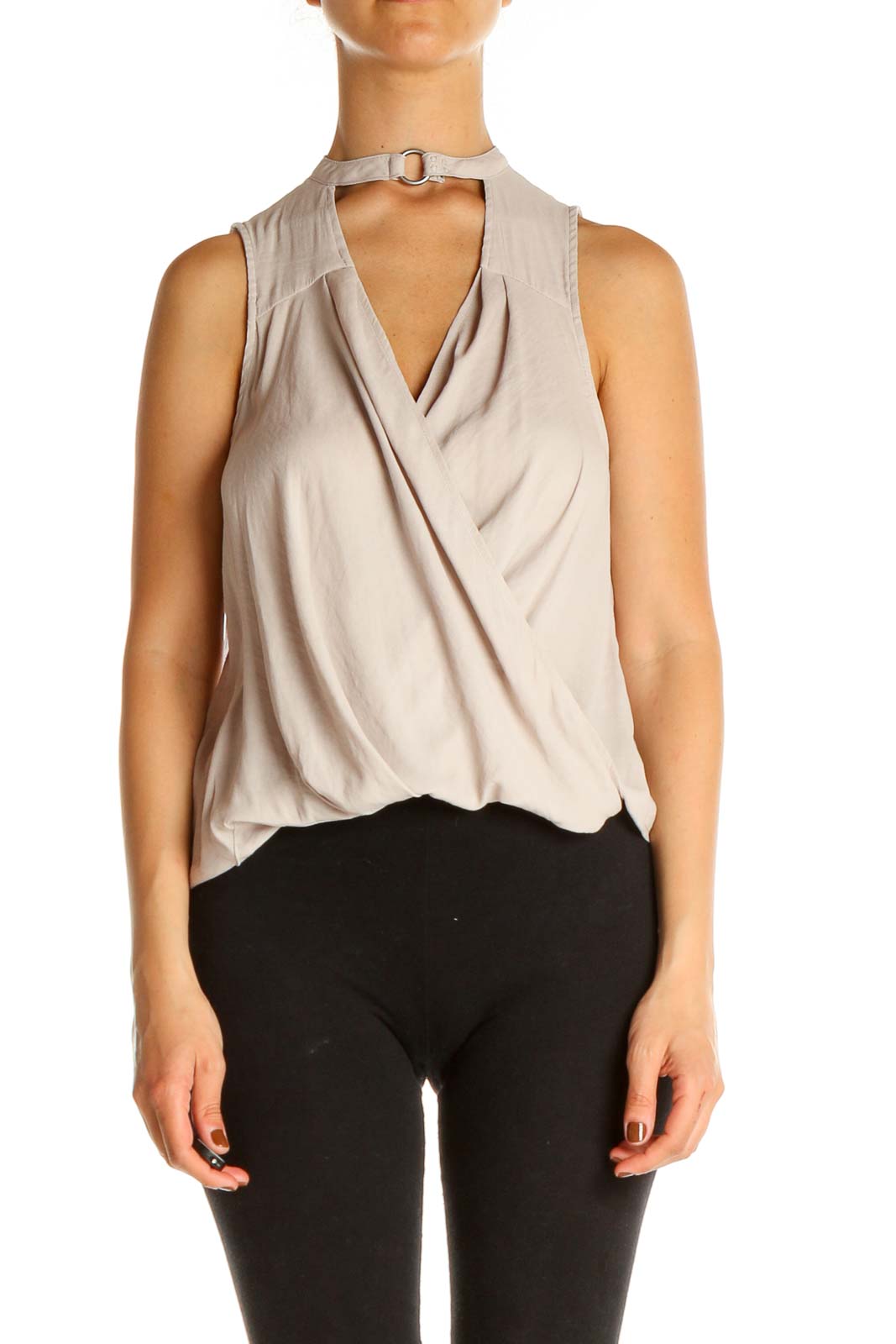 Front view of Free People beige sleeveless wrap top with choker neckline