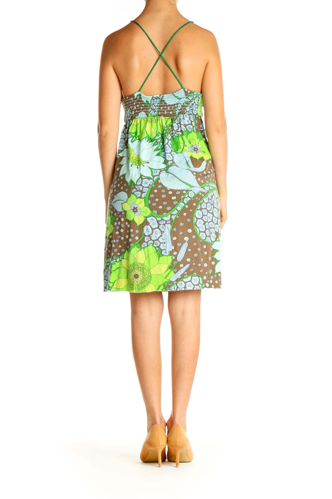 Back view of Free People green floral print sundress showing criss-cross strap detail