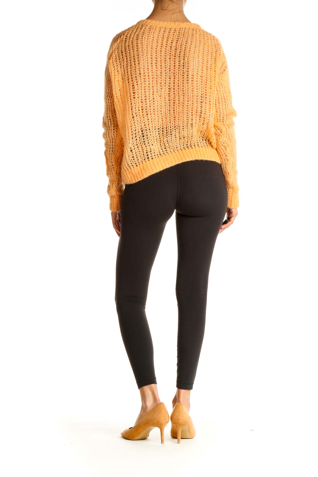 Back view of orange oversized open knit sweater from Free People