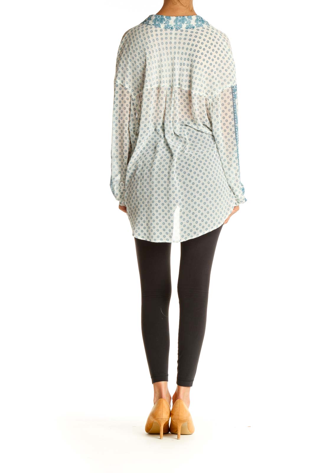 Back view of Free People white button-up blouse with blue polka dots showing relaxed fit