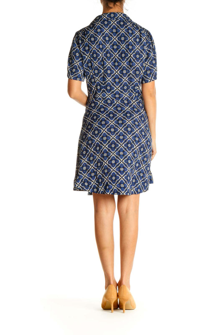 Back view of Free People blue geometric print short sleeve dress showing full pattern