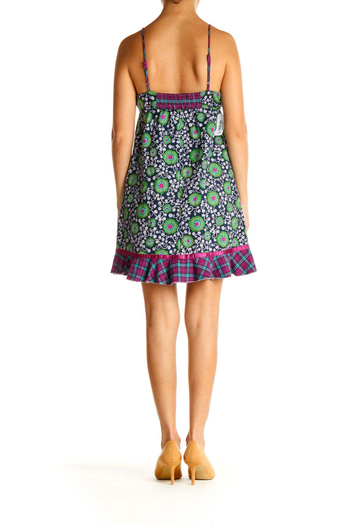 Back view of Free People sundress showing navy floral pattern and ruffled hem