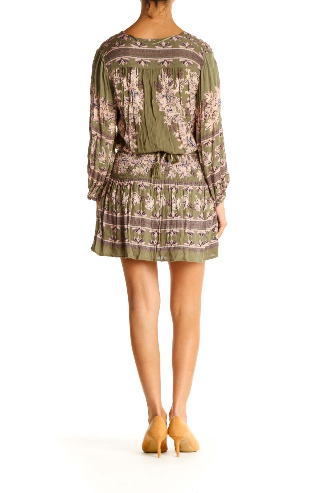 Back view of Free People green floral mini dress showing tiered skirt design