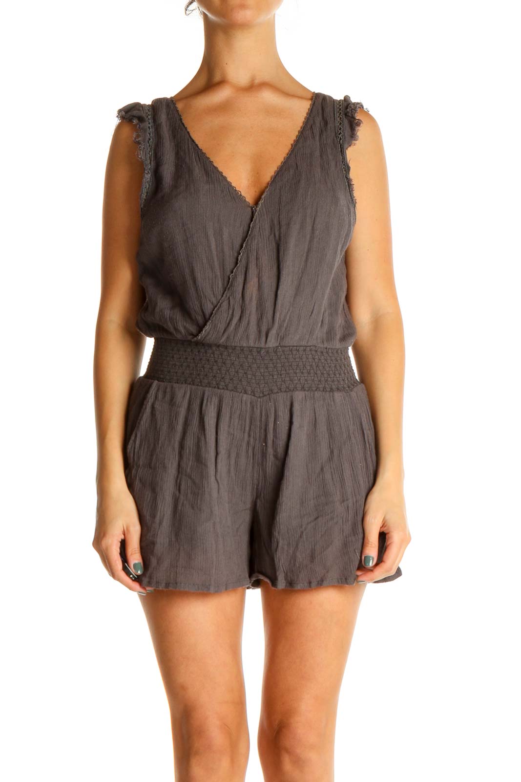 Front view of gray Free People romper with V-neck and smocked waist