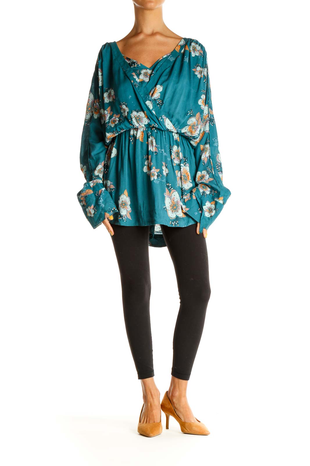 Front view of Free People teal floral wrap blouse with V-neckline and long sleeves