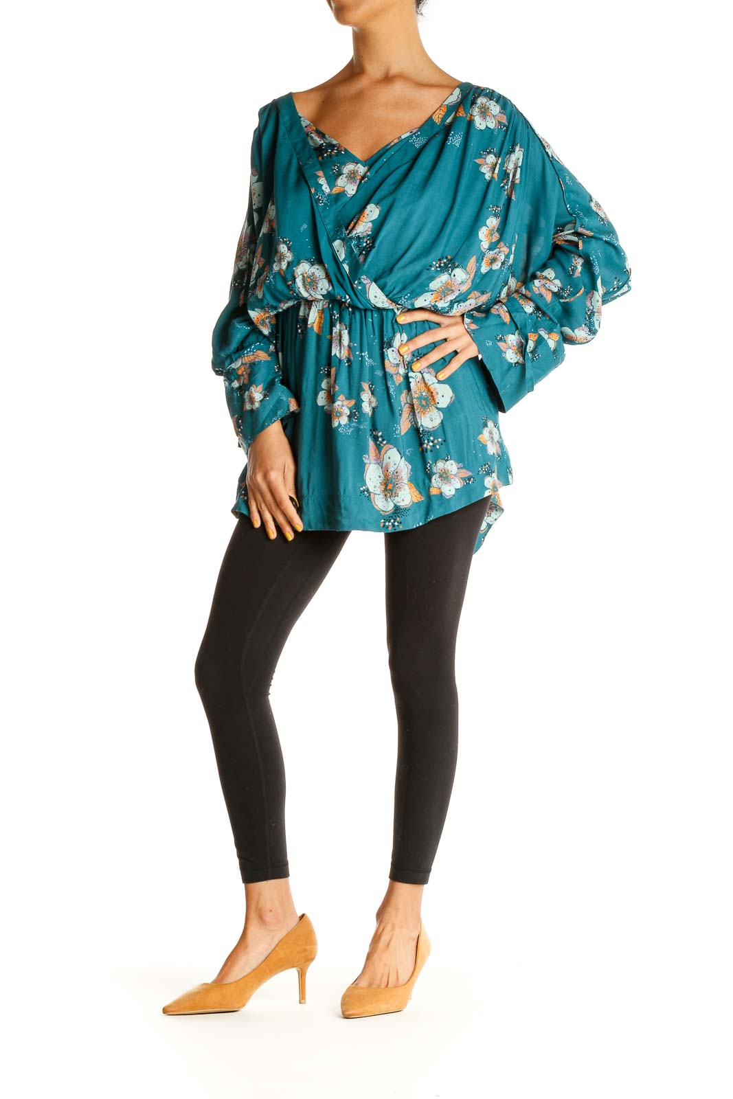 Front view of Free People teal floral wrap blouse with V-neckline and long sleeves