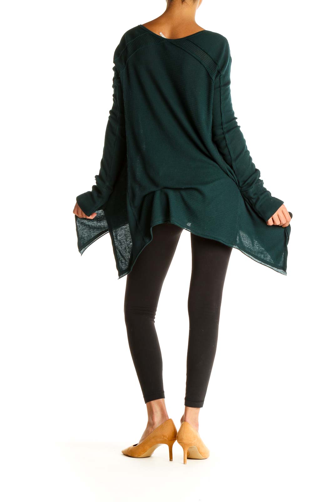 Back view of forest green Free People oversized sweater showing draping and asymmetrical hem