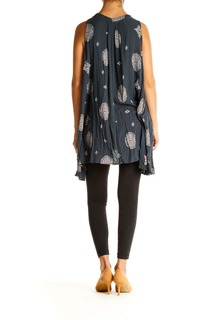 Back view of Free People navy tunic showing flowy silhouette and asymmetrical hem