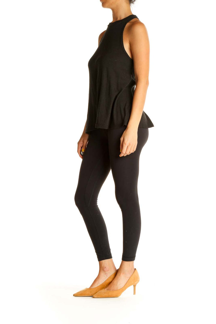 Front view of black Free People high-neck sleeveless tank top