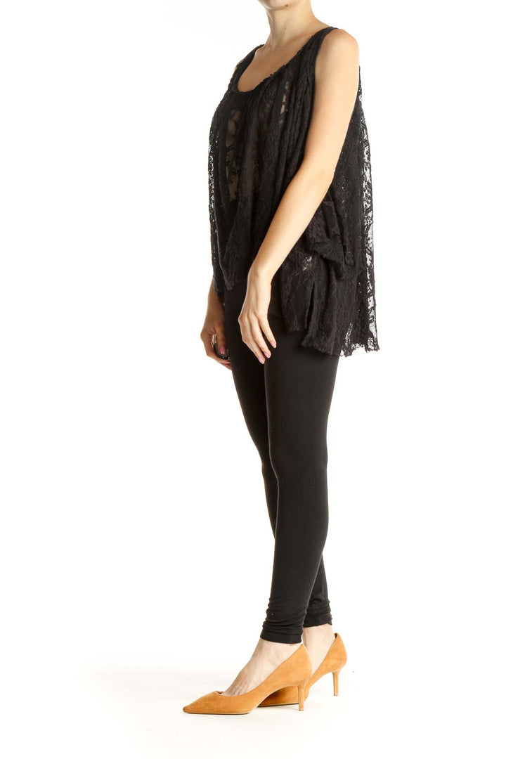 Front view of Free People black lace sheer flowy tank top