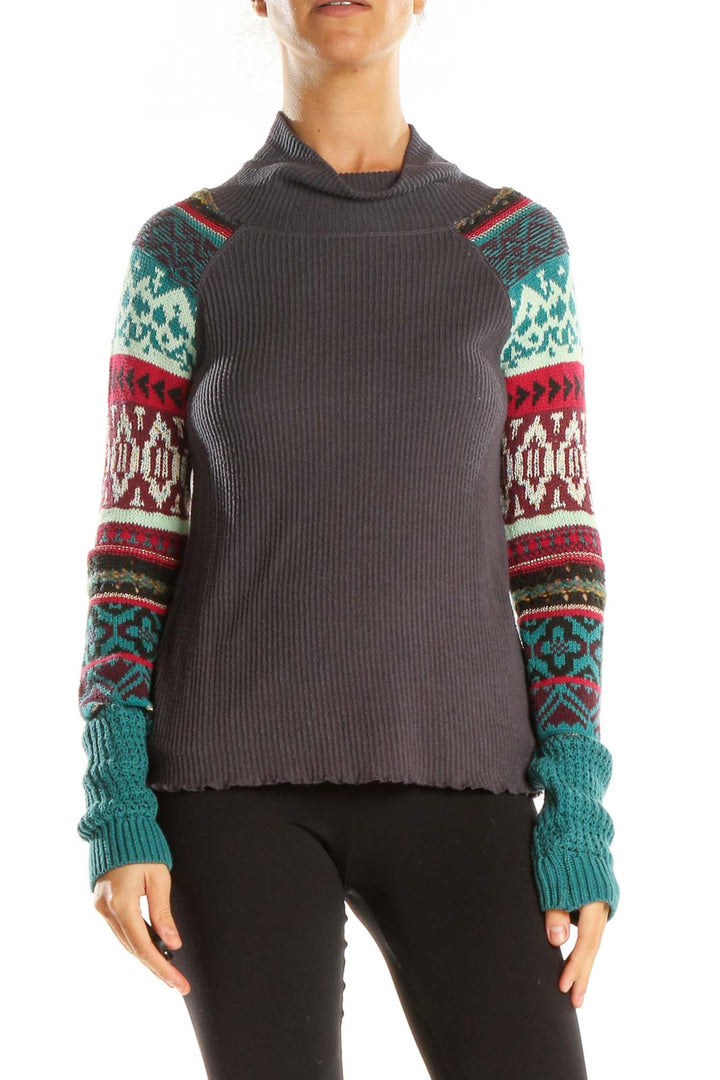 Front view of gray Free People turtleneck sweater with colorful patterned sleeves