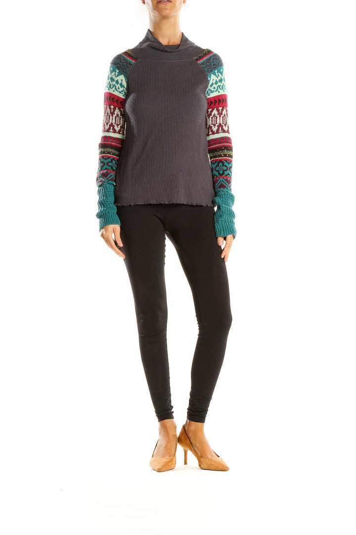 Front view of gray Free People turtleneck sweater with colorful patterned sleeves