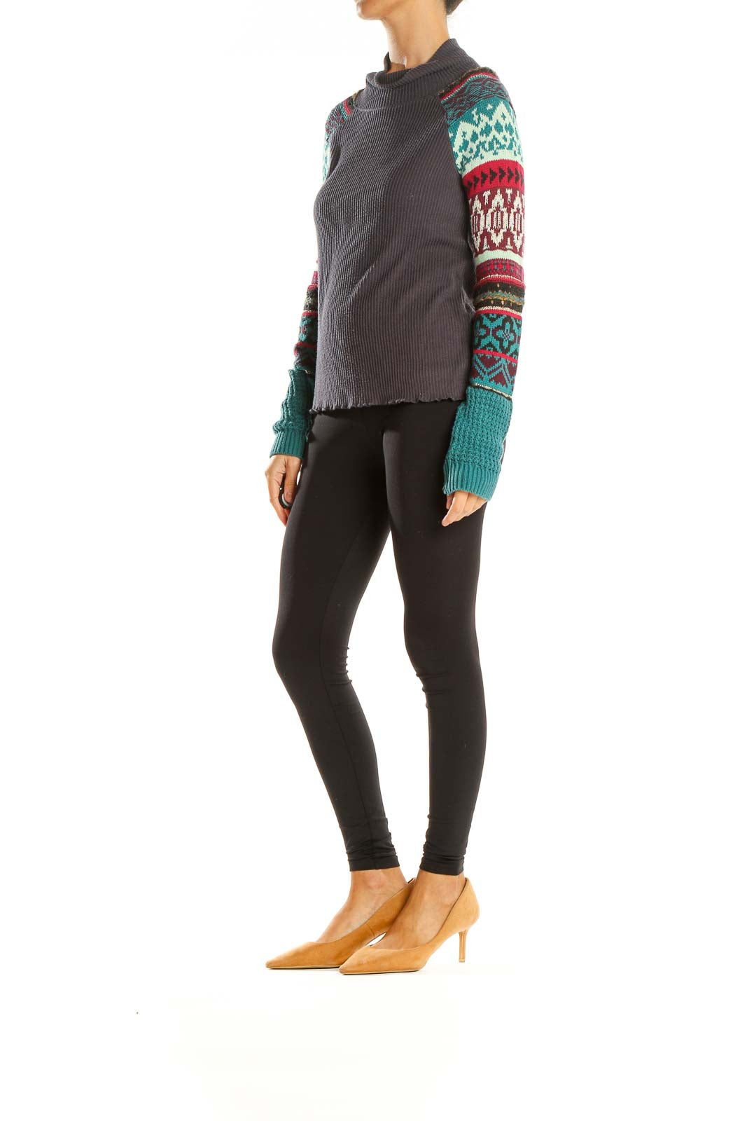 Front view of gray Free People turtleneck sweater with colorful patterned sleeves