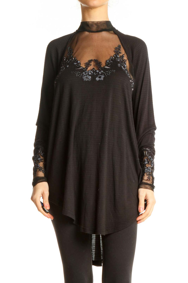 Front view of Free People black sheer embroidered long sleeve top