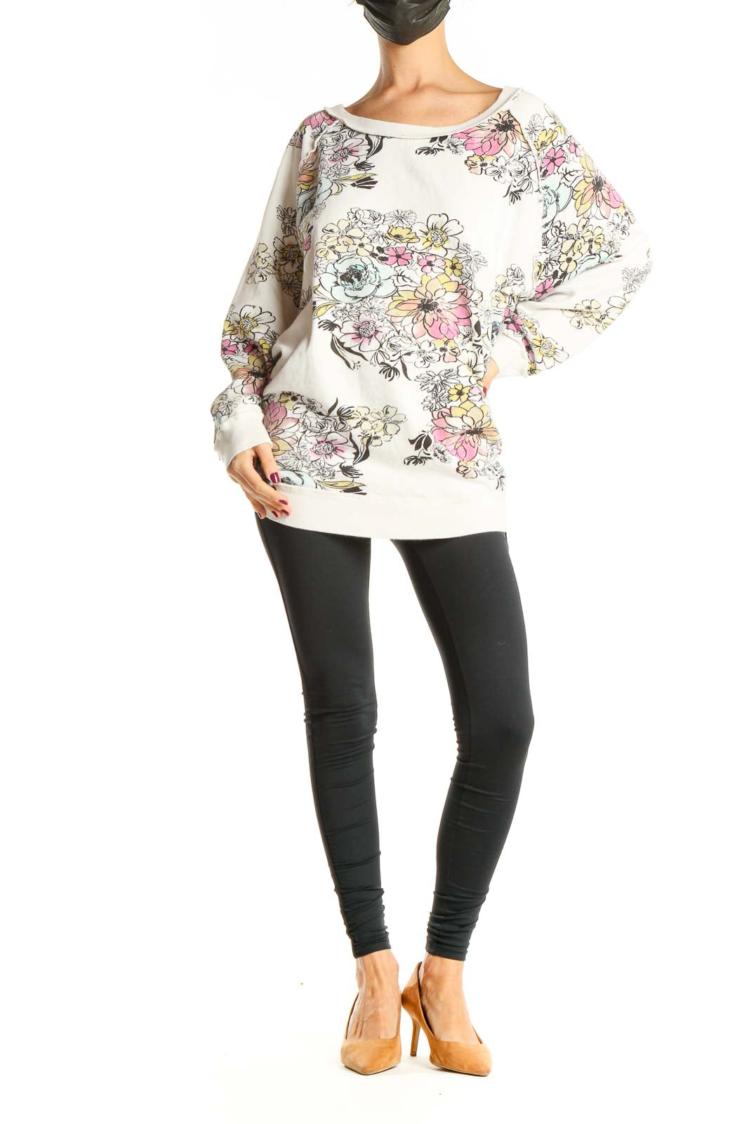 Front view of Free People white oversized sweatshirt with colorful floral print