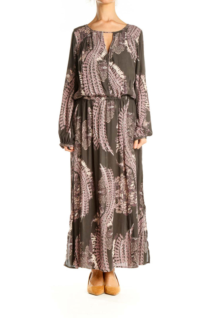 Front view of Free People brown floral maxi dress with long sleeves and keyhole neckline