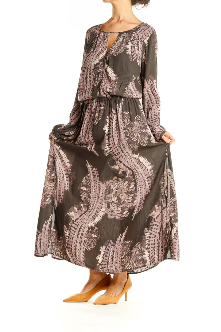 Front view of Free People brown floral maxi dress with long sleeves and keyhole neckline