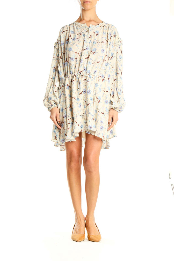 Front view of cream floral print mini dress with long sleeves