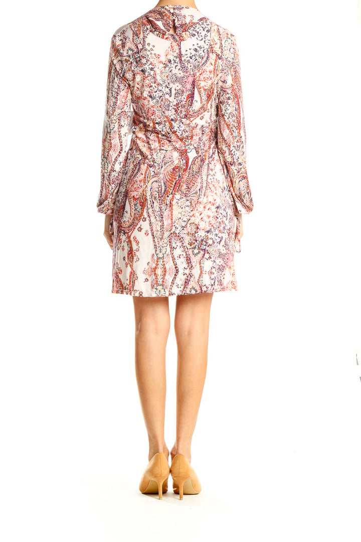 Back view of Free People white floral paisley mini dress showing all-over print