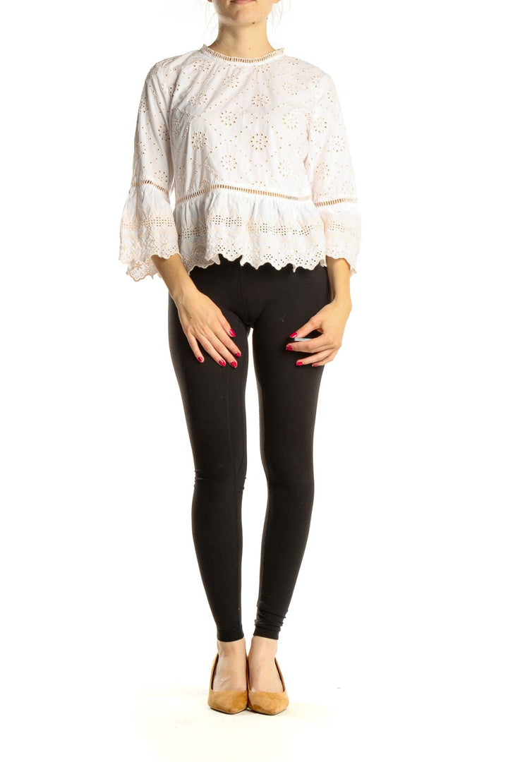 Front view of Free People white eyelet lace crop top with bell sleeves