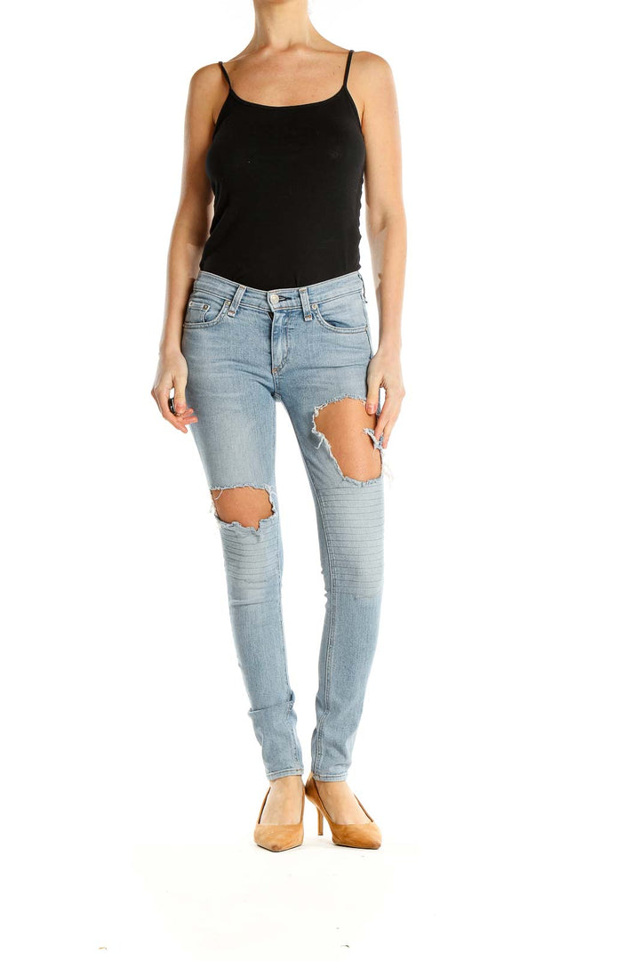 Front view of Rag & Bone light blue distressed skinny jeans with knee rips