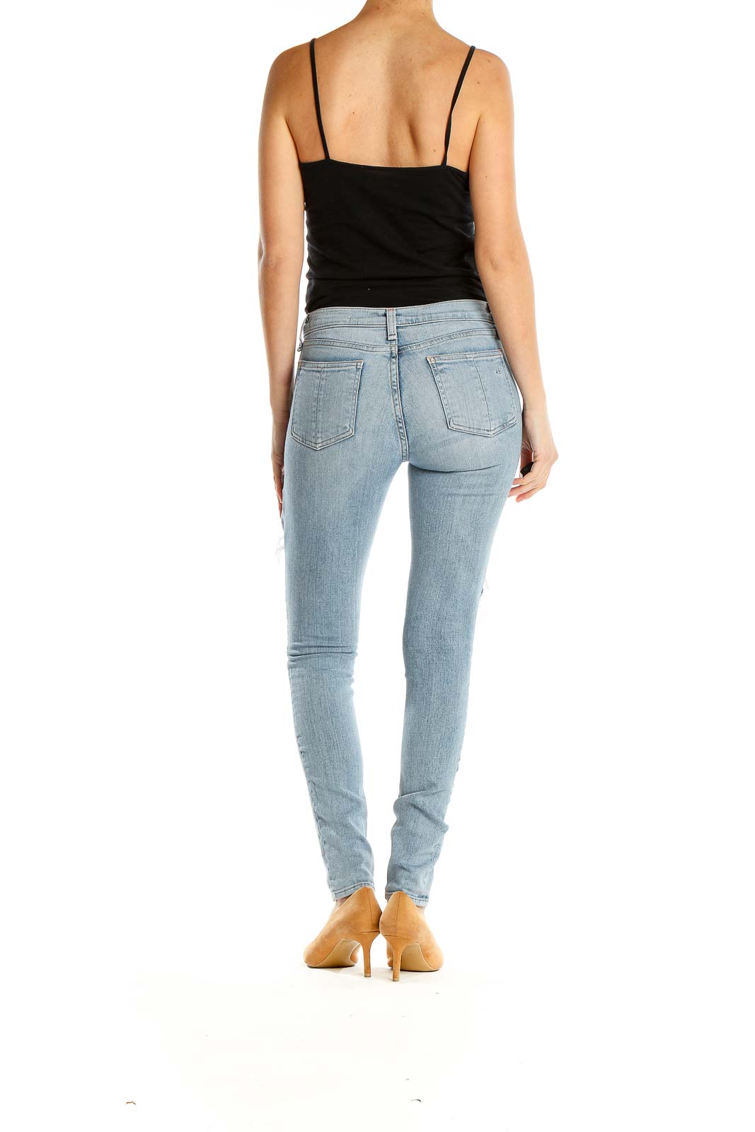 Side view of Rag & Bone light blue distressed skinny jeans on model