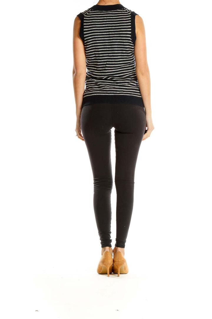 Side view of J.Crew black and gray striped sleeveless V-neck knit top on model