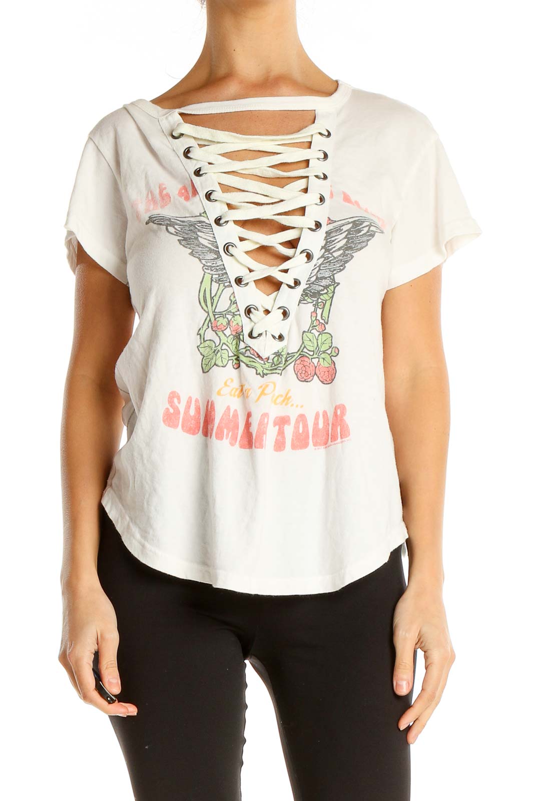 Front view of white Free People t-shirt with lace-up neckline and winged graphic design