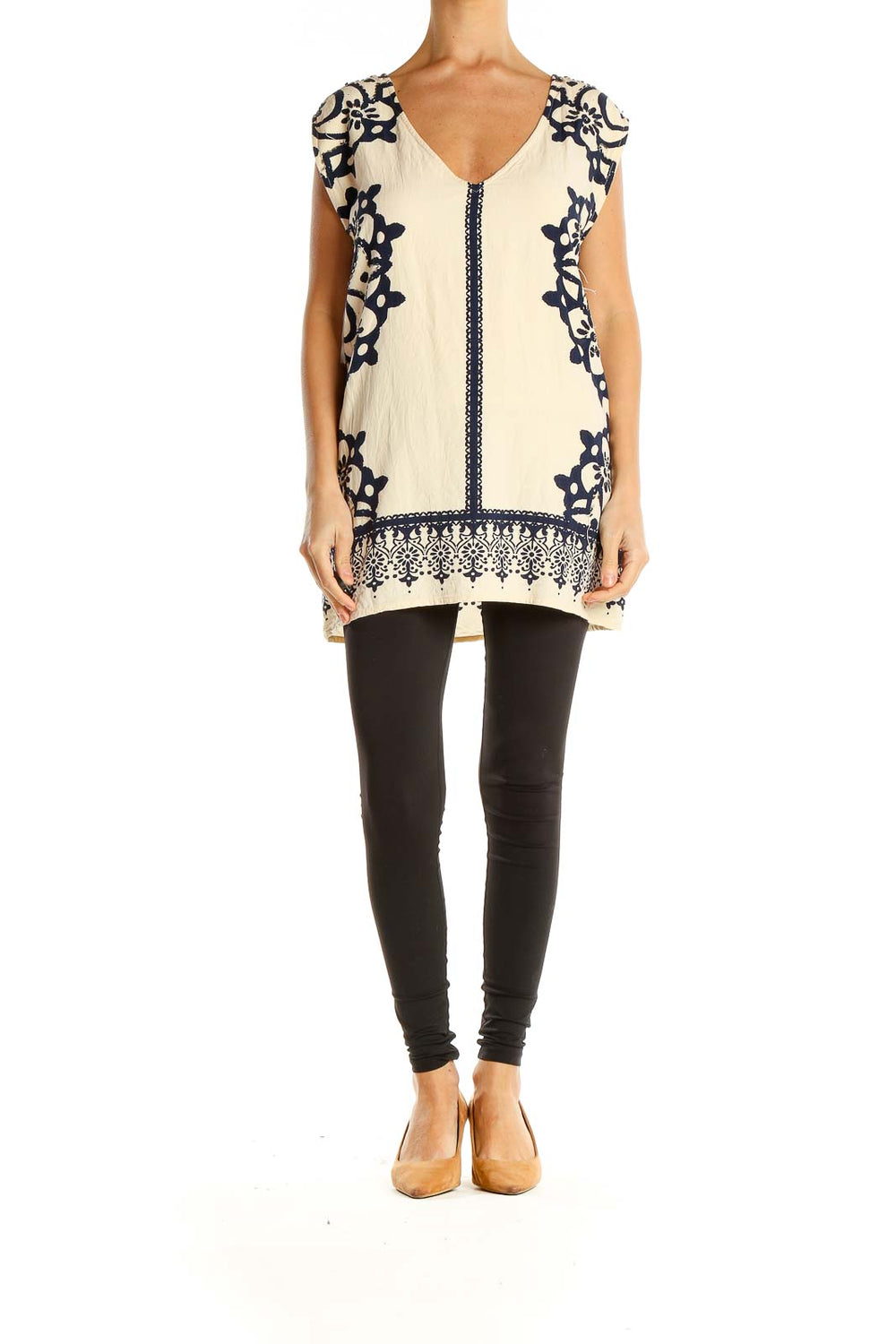 Front view of cream Free People tunic top with navy embroidery